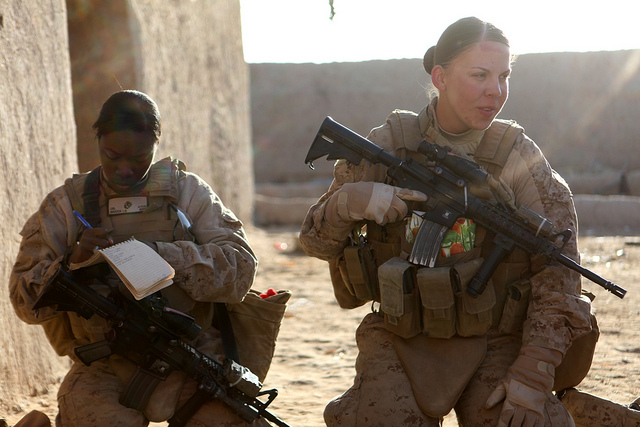 U.S. Marines assigned to the female engagement team (FET) attached to Foxtrot Company, 2nd Battalion, 3rd Marine Regiment conduct a security patrol in Marjah, Helmand province, Afghanistan, Jan. 3, 2011. The FET aids the infantry Marines by engaging Afghan women and children in support of the International Security Assistance Force. DoD photo by Marine Corps Cpl. Marionne T. Mangrum.