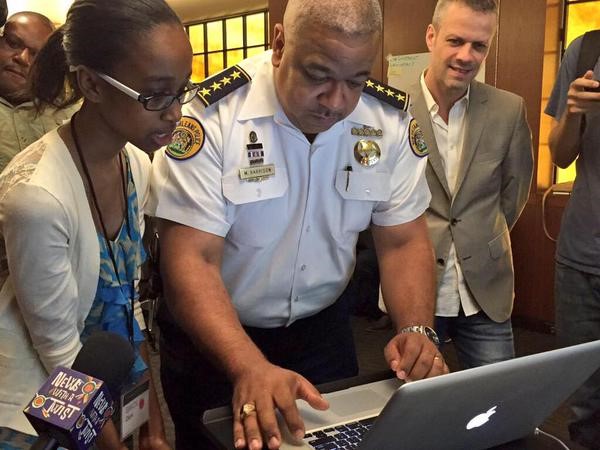 Fifteen-year-old Grace Clark teaches New Orleans Police Superintendent Michael Harrison how to write his first line of code. 