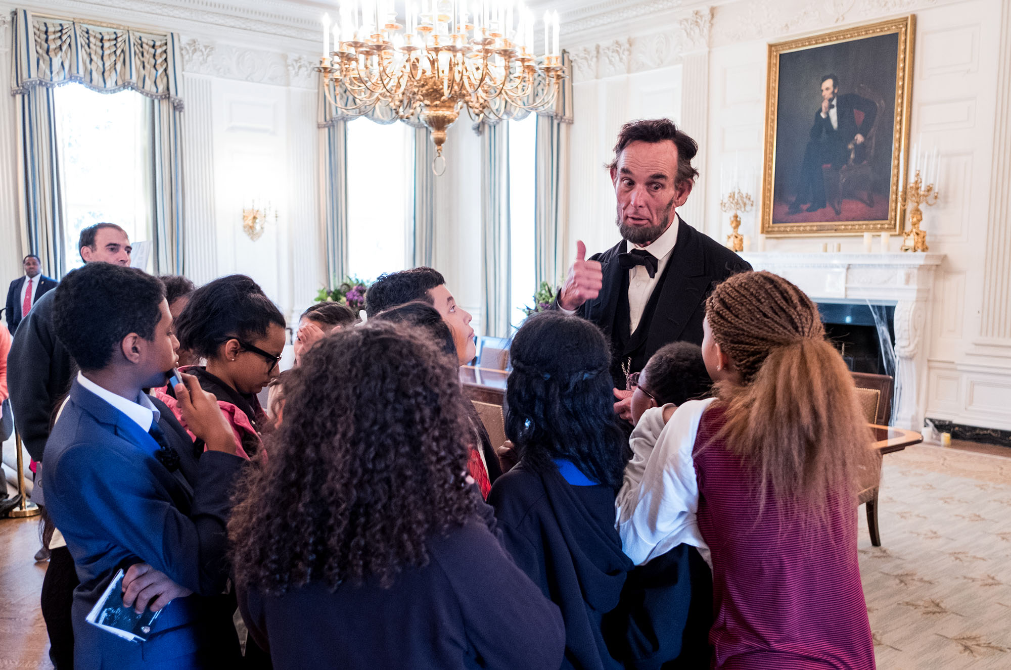 Abraham Lincoln interpreter Richard "Fritz" Klein of Springfield, Ill., talks with student visitors during their tour in the State Dining Room of the White House, Oct. 28, 2016. 