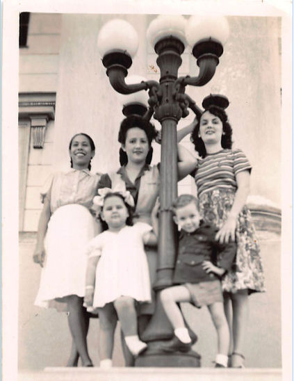 Author's abuela poses with family and friends in Havana, Cuba.