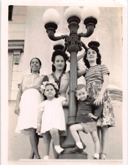 The author's family members stand on the beaches of Cuba