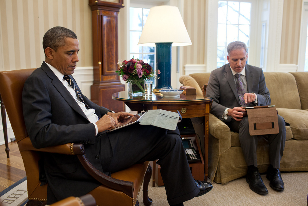 President Barack Obama receives the Presidential Daily Briefing from Robert Cardillo, Deputy Director of National Intelligence for Intelligence Integration, in the Oval Office, Jan. 31, 2012. Part of the briefing was done using a tablet computer. (Official White House Photo by Pete Souza)