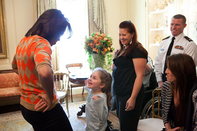First Lady Michelle Obama greets USO honorees and their families in the Vermeil Room of the White House