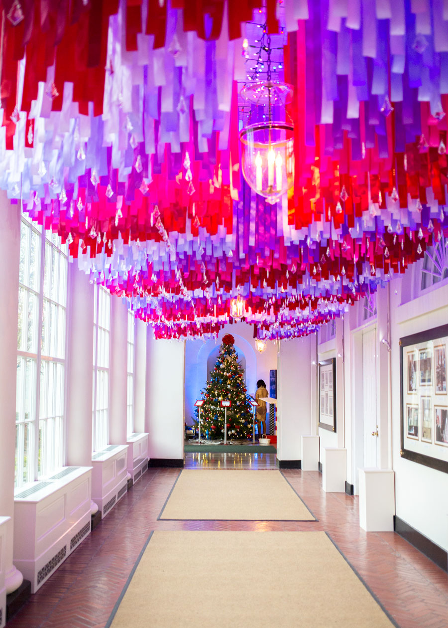 Red and blue ribbons cascade from the ceiling in the East Colonnade.