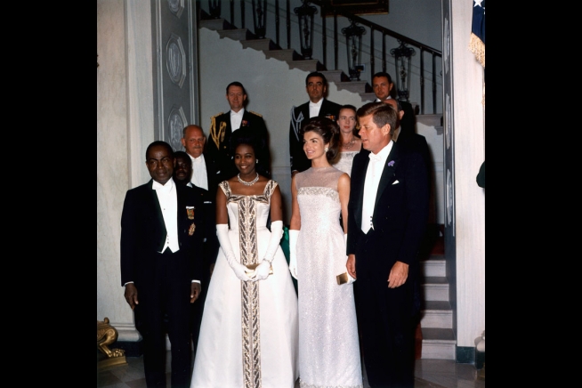 State Dinner for the President Houphouet-Boigny of the Ivory Coast. L-R, President and Madame Houphouet-Boigny, President and Mrs. Kennedy at the Grand Staircase. 5/22/62.