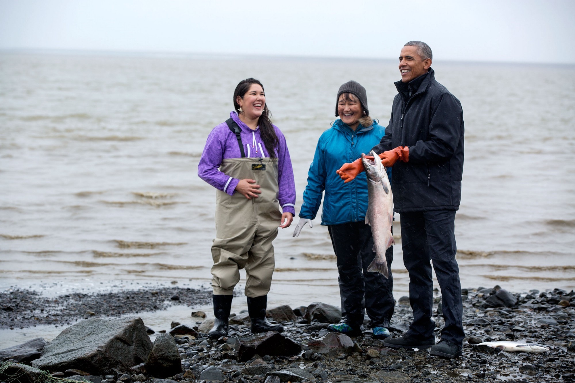 Getting a hands on demonstration from salmon fisherwomen. (Official White House Photo by Pete Souza) 